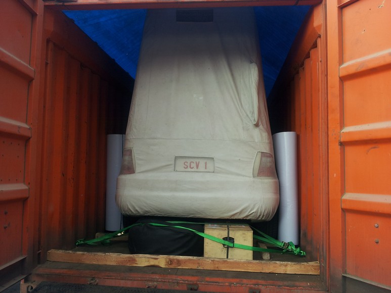 The Papa Mobile (SCV 1) covered and lashed inside a shipping container